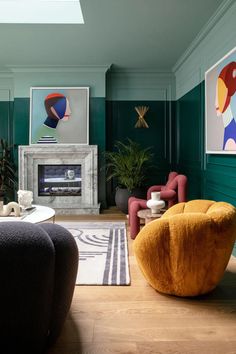 a living room filled with furniture and a fire place next to a painting on the wall