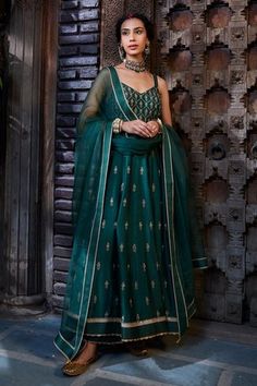 Teal anarkali with zari, dabka, pearl embroidery in floral pattern. Paired with pant and dupatta.
Components: 3
Pattern: Embroidery
Type Of Work: Zari, dabka, floral, pearl
Neckline: V neck
Sleeve Type: Sleeveless
Fabric: Anarkali and Pant: Silk, Dupatta: Organza
Color: Green
Other Details: 
Sheer embroidered dupatta
Scallop bordered lace hem
Occasion: Wedding - Aza Fashions Teal Anarkali, Anarkali Patterns, Green Anarkali, Silk Anarkali, Embroidered Anarkali, Pearl Embroidery, Embroidered Dupatta, Pattern Embroidery, Silk Dupatta