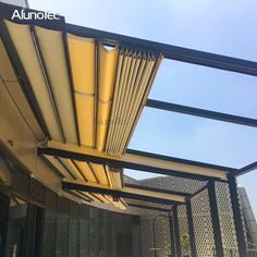 an awning is attached to the side of a building with metal bars on it