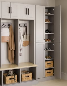 an organized closet with white cabinets and baskets