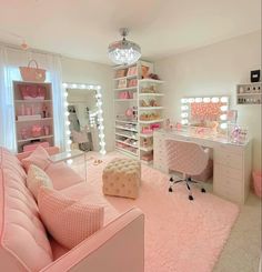 a bedroom with pink furniture and lots of lights