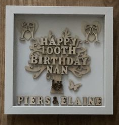 a white frame with an image of a happy birthday tree and words on the front