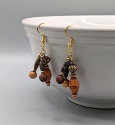 Brown wooden dangle earrings. Lightweight and casual for everyday wear. Great gift for someone with a boho style or nature lover. Various size and shape wood beads on ear wires. They are approximately 2.25 inches long. ❤️Size Length is approximately 1.75 inches and width .75 inches. ❤️All ear wires can be switched to sterling silver hooks. Please allow 2 extra days for process. ❤️Shipping Processing time is 1-2 business days. USPS shipping is 2-5 days. If you need expedited shipping please send a message. ❤️Return and Exchange If you item arrives damaged or if you are unhappy please send a message. Exchanges or refunds are allowed within 30 days. Buyer pays return shipping when refunds are issued. ❤️Custom orders and orders for multiples are accepted. Turn around time is generally a week i Cheap Brown Earrings With Dangling Beads, Cheap Brown Dangling Beads Earrings, Wood Dangle Earrings, Brown Earrings, Handmade Earrings Beaded, 5th Anniversary, Jewelry Beaded, Jewelry For Her, Earrings Boho