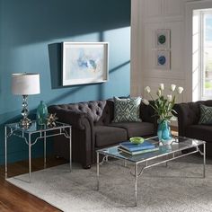 a living room with blue walls and furniture