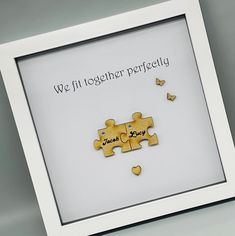 a white frame with some puzzle pieces in it and the words we fit together perfectly