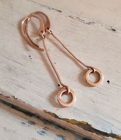 Minimalist bronze stick circle earrings Everyday Heart Pendant Jewelry, Copper Dangle Jewelry As Gift, Copper Dangle Jewelry For Gift, Unique Rose Gold Dangle Jewelry, Unique Everyday Dangle Jewelry, Copper Drop Earrings, Elegant Copper Dangle Necklaces, Everyday Copper Dangle Earrings, Everyday Copper Drop Earrings