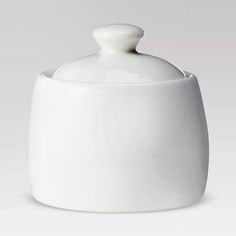 a white porcelain container with a lid