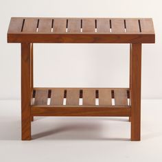 a wooden table with two shelves underneath it