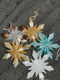 four snowflakes are laying on a blanket