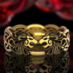 "With two snarling Lion heads, this unique ring embodies the strength and majesty of one of nature's most beautiful felines. Known as the \"King of Beasts,\" the Lion has prominently influenced human art and culture for millennia with their distinct appearance. Holding the dual symbolism of ferocity and protection, these creatures can represent of the often complex nature of familial relationships. With intricate manes flowing into infinity knotwork, this bold design suggests a passionate, forev Lion Ring Gold, Snarling Lion, Celtic Lion, Mens Celtic Wedding Bands, Celtic Knotwork Design, Ring Cat, Infinity Knot Ring, Celtic Wedding Bands, Lion Jewelry