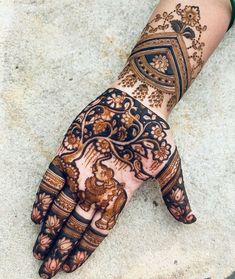 the hand is decorated with intricate designs