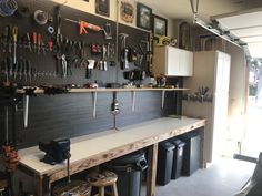 a garage with lots of tools hanging on the wall