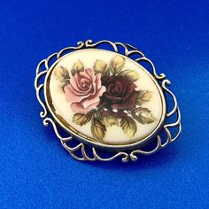 * Vintage Hallmarked Sterling Silver 925 Oval Floral Enamel Open Work Pin Brooch * Length: 1-3/4" * Width: 1-1/16" * Oval enamel measures: 1.0" x 3/4" and depicts one red and one pink rose bouquet * Weight: 5.3 tgw * Marked: Makers Mark*925*Hallmark * Condition: Great * S783    Exported By ExportYourStore :) Oval Cabochon Brooches For Anniversary, Classic Oval Brooches For Collectors, Vintage Enamel Oval Pendant Jewelry, Vintage Enamel Brooches For Anniversary, Vintage Round Enamel Pin For Gift, Vintage Oval Enamel Jewelry, Vintage Oval Brooches For Collectors, Vintage Enamel Cabochon Brooches, Pink Rose Bouquet