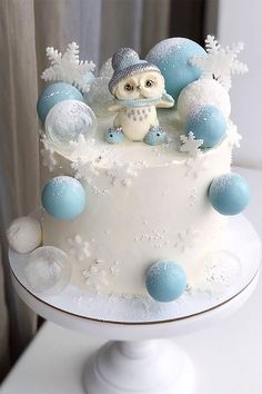 a white cake with blue and white decorations