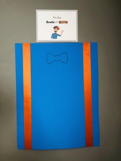 a blue bag with an orange stripe and a bow tie on it's side