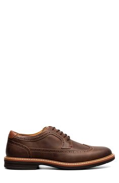 A fully cushioned insole and flexible sole ensure lasting comfort in this polished leather oxford featuring classic brogued detailing. Lace-up style Removable insole Leather upper/textile lining/rubber sole Imported Business Casual Oxford Lace-up Shoes With Brogue Detailing, Low-top Oxfords With Brogue Detailing, Business Low-top Oxfords With Brogue Detailing, Classic Brown Oxfords With Perforated Toe Box, Classic Brogue Lace-up Derby Shoes, Classic Brogue Derby Shoes, Classic Business Casual Lace-up Shoes With Perforated Toe Box, Wingtip Oxfords With Branded Insole For Derby, Business Wingtip Oxfords With Removable Insole