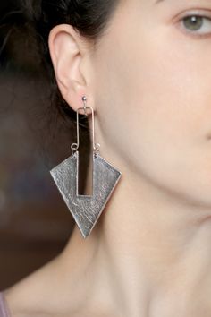 Modern Drop Earrings, Metal Chandelier Earrings, Modern Clip-on Drop Earrings, Modern Single Drop Plug Earrings, Metal Chandelier Drop Earrings, Modern Dangle Plug Earrings For Party, Modern Metal Dangle Clip-on Earrings, Metal Dangle Wrap Earrings For Pierced Ears, Metal Wrap Dangle Earrings For Pierced Ears