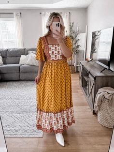 Model is 5'1", 34D, 6/28 and is wearing a size medium. Item runs true to size. Golden Poppy Maxi Dress features a golden yellow, brown boho pattern, square neckline lined with dainty lace, flowy short sleeves, smocked back, hidden side zipper, true maxi length. More details:100% polyester. hand wash or wash on cold and hang to dry. Brown Bohemian Square Neck Dress, Brown Bohemian Dress With Square Neck, Fitted Bohemian Maxi Dress With Square Neck, Yellow Bohemian Short Sleeve Maxi Dress, Yellow Bohemian Maxi Dress With Short Sleeves, Bohemian Yellow Maxi Dress With Short Sleeves, Mustard Bohemian Flowy Dress, Mustard Bohemian Maxi Dress, Golden Poppy