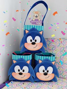 three sonic the hedgehog slippers sitting on top of each other