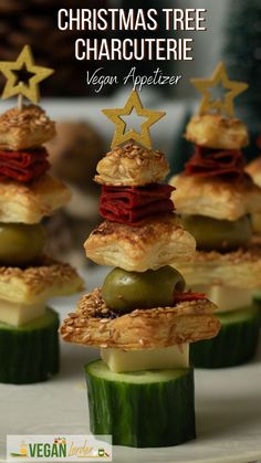 christmas tree food is stacked on top of cucumber slices and topped with cheese