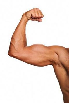 a man flexing his muscles in front of a white background