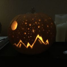 a carved pumpkin sitting on top of a table