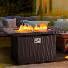 a fire pit sitting on top of a wooden table