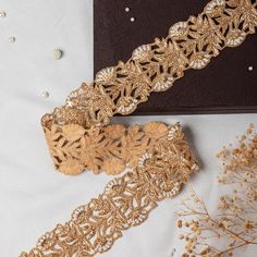 Luxury Hand-Embroidered Gold Lace Trim with Pearl Embellishment | Wedding Dress & Saree Décor Cut Work Border | Premium Sewing Edging This beautiful Lace can be used for designing stylish blouses, shrugs, skirts, tunics, festive wear, wedding wear and dresses. This stunning lace trim is great for any sewing and craft projects. A perfect embellishment for a bridal dresses or for any festive mood outfit. Our lace will add mystique to your fabric, you can use this lace alone or add it with other laces to create a new unique design for, any of your project : ➤dress border, dupattas, scarves and veils ➤jewelry making, ➤for making a DIY belt ➤designing stylish blouses, ➤waist belt to match your plain outfit ➤festive wear, wedding wear, dresses ➤Embellish your clutch purses ➤Can also be incorpora Wedding Dress Saree, Diy Belt, Dress Saree, Stylish Blouses, Diy Belts, Pearl Embellishment, Plain Outfits, Festive Wear, Gold Lace