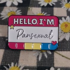 a pin with the words hellom paresenal written in black ink on it