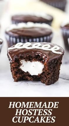 homemade hostess cupcakes with chocolate frosting and marshmallows in the middle