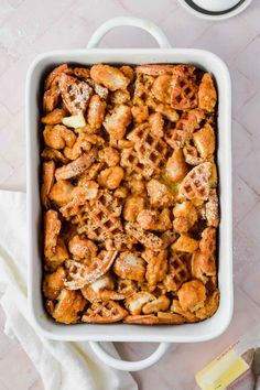 a casserole dish with chicken and waffles in it