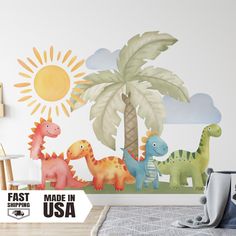 a child's bedroom with dinosaurs painted on the wall and palm tree in the background