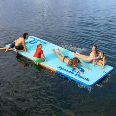 three girls and two boys are on a floating pool in the water