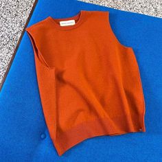 The extreme cashmere no.156 be now top is a classic crewneck sweater vest with a rib knitted neck and waistline.    one size. unisex    88% cashmere 10% nylon 2% spandex.    shoulder to shoulder: 39cm.  chest: 53cm.  hem width: 43cm.  total length: 55cm.    care: to retain its quality for a long time cashmere requires some special care. cashmere loves water. wash it regularly in a machine on a wool program (30ºc 600rpm) using wool detergent or baby shampoo and no softener. put each garment in a separate washing bag or pillow case. do not run a cycle with more than three garments at once.    after washing dry the garment flat on a towel. iron at low temperature using always a damp cloth between the iron and the cashmere. store the garment folded.    "one material one size for everybody and Extreme Cashmere, Baby Shampoo, Dark Orange, Wash Bags, Crewneck Sweater, Sweater Vest, Crew Neck Sweater, Rib Knit, Cardigans