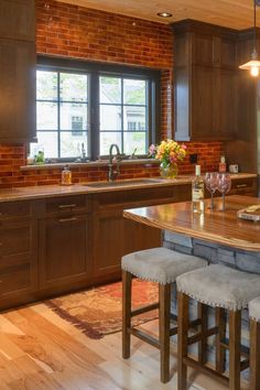 a kitchen with wooden cabinets and counter tops