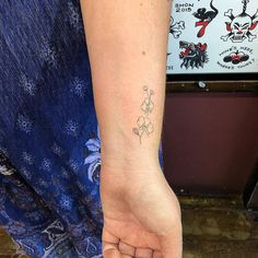 a person with a small tattoo on their arm