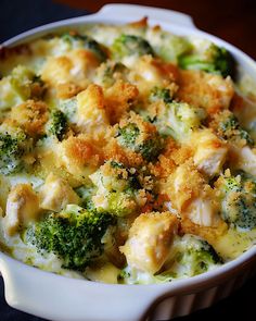 a casserole dish with broccoli and chicken in it