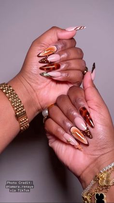 Fall nails are officially in!✨ Credit to the amazing Tamara Renaye for these stunning tortoiseshell-inspired tips with luxe gold accents. This look perfectly blends cozy autumn vibes with a touch of glam. The rich, earthy tones mixed with sleek patterns make this manicure a must-have for the season. Whether you’re spicing up your fall wardrobe or just wanting to feel extra fabulous, these nails will do the trick. Pin this for major nail inspo on your next salon visit! Fall nail color ideas. Fall 2024. Nail ideas for the fall. Almond nails. Long nails. Tamara Renaye Nails, Nails Chinese Design, Fall Maximalist Nails, Fall Nails Extra, Fall Junk Nails, Fall Stilleto Nail Ideas, Dope Nail Designs Fall 2024, Nail Color Ideas Fall, Almond Nails 2024