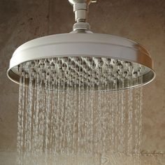 a shower head with water flowing from it