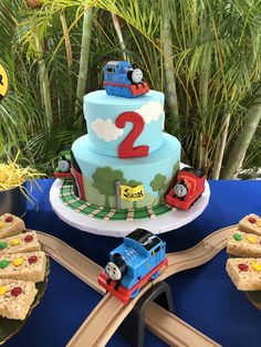 a birthday cake with thomas the train on top