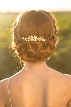 the back of a woman's head wearing a hair comb