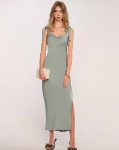 Perfect for a warm weather wedding, the Cinta Dress is a maxi length bias cut slip dress with tie straps and a side slit to show some leg. Pair with sandals for an easygoing vibe or dress it up with heels. 95% Polyester / 5% Spandex Return Policy ALL regular price items may be returned for a store credit. Items must be received by us within 14 days. Item must still have tags on and be unworn. ***JEWELRY, handbags, lingerie, scarves, swimwear, hats, shoes, and SALE items are FINAL SALE.*** elle B Dress With Tie Straps, Vegan Leather Bag, Fall Coat, Dress With Tie, British Indian, Dress Romper, Cowl Neck, Warm Weather, Midi Length