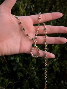 Handmade necklace in gold-toned tarnish resistant copper wire and green beads. Alternating green and gold beads end in a handmade swirling pendant. 17 1/2 inches, adjustable.  Made with 20 gauge wire. While generally sturdy, as with all wire jewelry, there is potential for the wire to be bent, so please handle with care. Hand Wrapped Gold Necklace With Copper Wire, Green Metal Necklace With Adjustable Chain, Green Copper Hand Wrapped Necklaces, Green Hand Wrapped Copper Necklace, Hand Wrapped Copper Gold Necklace, Hand Wrapped Gold Copper Necklace, Green Necklaces With Gold Beads For Jewelry Making, Adjustable Green Beaded Necklaces Hand Wrapped, Adjustable Green Hand-wrapped Beaded Necklaces