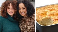 two women standing next to each other in front of a casserole dish and another woman with curly hair