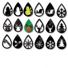 a group of black and white christmas tears with snowflakes, trees, deer, sleigh ornament on them