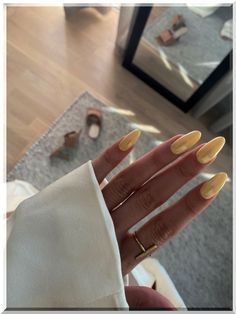 Capture the essence of sunny days with our radiant summer yellow nails! Flash a smile on your hands with a color that's as warm and inviting as a sunny afternoon. Pale Yellow Nails With Chrome, Pearl Yellow Nails, Pastel Yellow Nails With Chrome, Pastel Yellow Almond Nails, Pale Yellow Chrome Nails, Light Yellow Chrome Nails