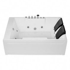 a large white bath tub with black accents