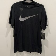 Nike Dri Fit Tee Featuring White Classic Logo On Front. Never Work And In Original Folded Packaging! Nike Black Relaxed Fit Tops, Military Hoodie, Nike Track Jacket, Hooded Long Sleeve Shirt, Neon Shorts, Navy Blue Hoodie, Blue Polo Shirts, Nike Hoodie, Nike Tees