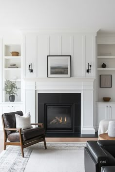 a living room filled with furniture and a fire place in the middle of the room