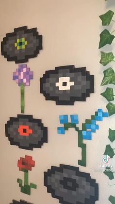 an image of pixel art with flowers on the wall